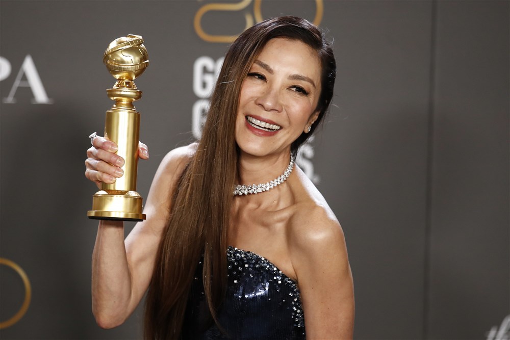 epa10399272 Malaysian actor Michelle Yeoh poses with the award for Best Actress in a Motion Picture Musical or Comedy in the press room during the 80th annual Golden Globe Awards ceremony in Beverly Hills, California, USA, 10 January 2023. Artists in various film and television categories are awarded Golden Globes by the Hollywood Foreign Press Association. EPA-EFE/CAROLINE BREHMAN