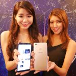 Two girls are happy with their Vivo V7+ smartphone.