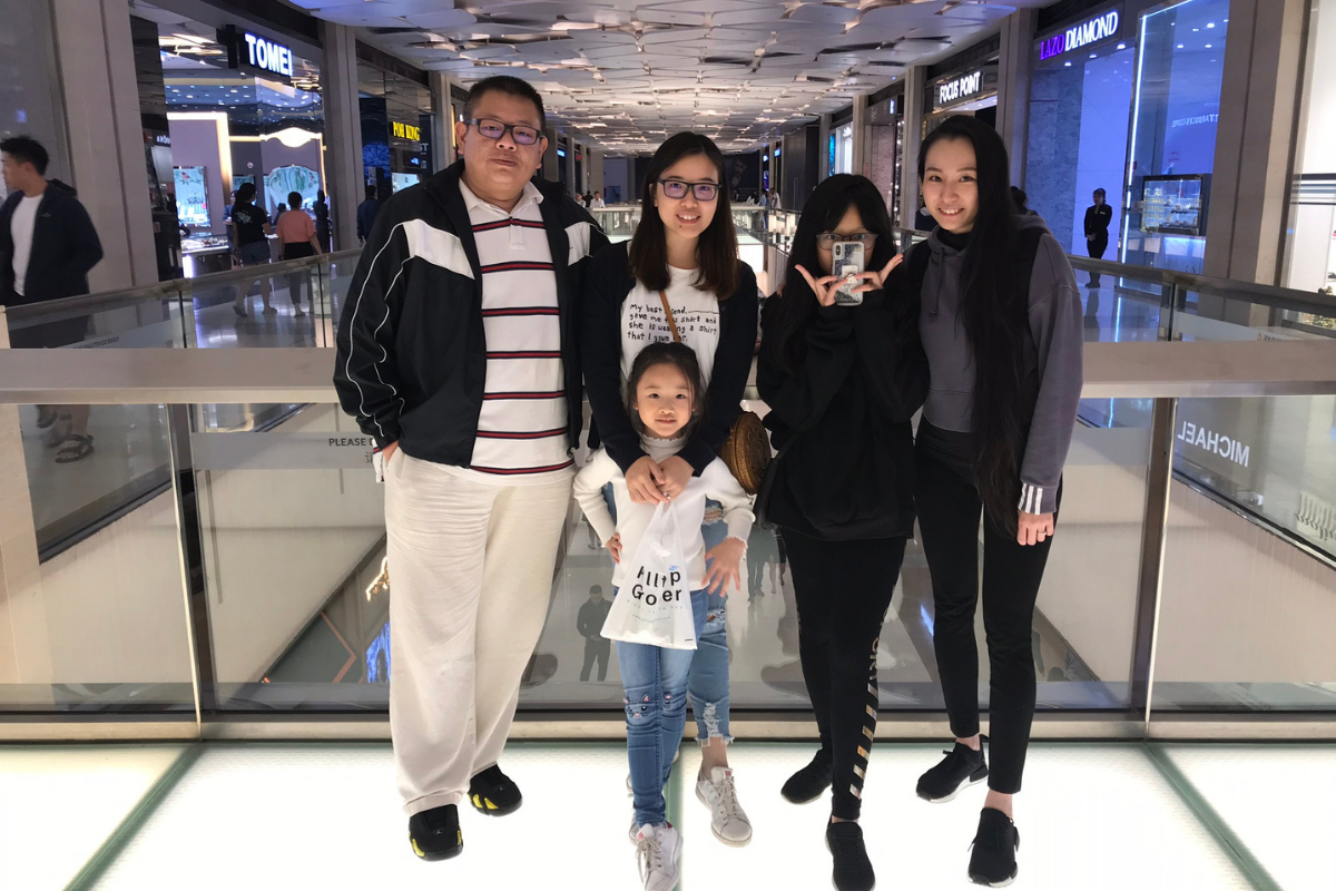 Jeremy (left), along with his wife, Ivy (2nd from left) and family having a day out at SkyAvenue Complex, Resorts World Genting.